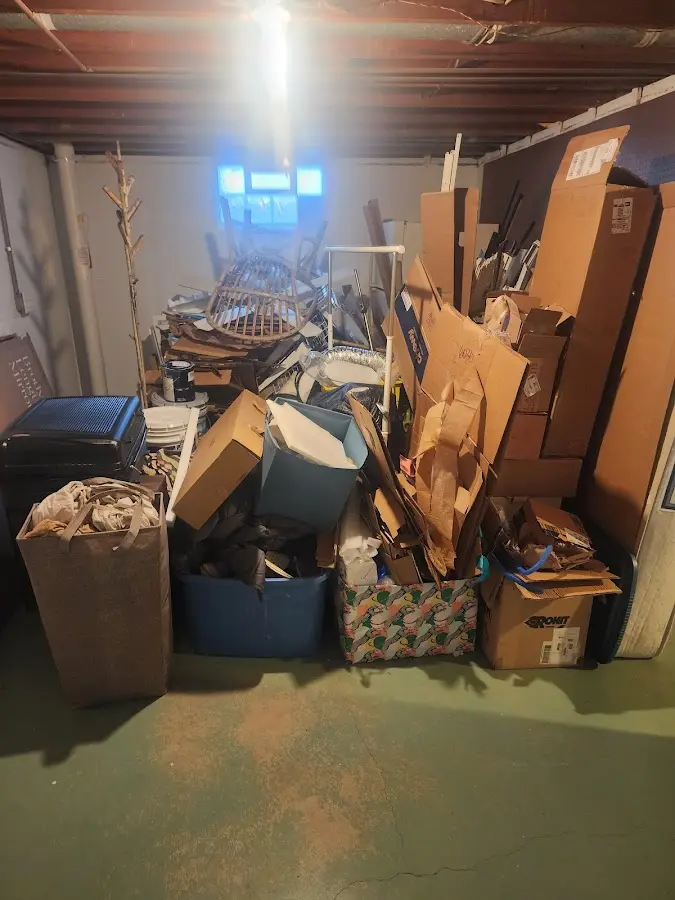 Roll-off dumpster container at job site for 8 Yard Dumpster Rental in Opelika